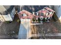 Aerial view of house, two-car garage, and driveway at 4038 Ash Tree St, Snellville, GA 30039