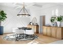 Elegant dining room with statement lighting and wood cabinets at 500 Ridgewater Dr, Marietta, GA 30068