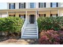 Front entrance with stairs and American flag at 40 Brompton Dr, Dallas, GA 30157