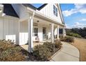 Inviting front porch with rocking chairs and a welcoming sign at 104 Whitley Ct, Dallas, GA 30157