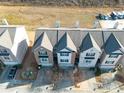 Aerial view of townhome showing roof, brick facade and driveway at 2116 Tidal Cv, Lawrenceville, GA 30043