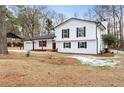 Two-story white house with a spacious yard and mature trees at 85 Hickory Dr, Stockbridge, GA 30281