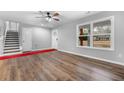 Bright and airy living room with hardwood floors and large windows at 85 Hickory Dr, Stockbridge, GA 30281