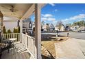 Cozy front porch with seating area and neighborhood view at 902 College Place Nw Ct, Kennesaw, GA 30144