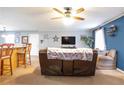 Living room with brown couch and large TV at 45 Hunters Ridge Ct, Covington, GA 30014