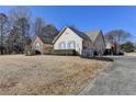 House exterior showcasing landscaping and driveway at 4065 Delamar Dr, Cumming, GA 30041