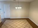 Dining area with tile floor and chandelier at 4551 Jackybell Trl, Decatur, GA 30034