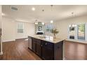 Spacious kitchen with island, stainless steel appliances, and granite countertops at 116 Centennial Ridge Dr, Acworth, GA 30102