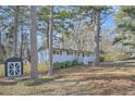 Newly renovated home with a large backyard and wooden fence at 127 Robinhood Dr, Woodstock, GA 30188