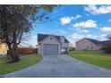 Front view of a house showcasing its gray exterior and a spacious yard at 6110 Dorsett St, Douglasville, GA 30134