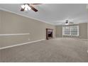 Bright living room featuring a fireplace and ceiling fan at 2105 Cornerstone Sw Ln, Marietta, GA 30064