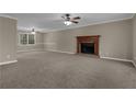 Spacious living room with fireplace and neutral carpeting at 2105 Cornerstone Sw Ln, Marietta, GA 30064