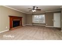 Bright living room with fireplace and large window at 2105 Cornerstone Sw Ln, Marietta, GA 30064