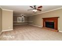 Spacious living room featuring a fireplace and neutral carpeting at 2105 Cornerstone Sw Ln, Marietta, GA 30064