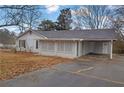 Front view of a ranch home with a carport at 280 Belmont Farms Dr, Ellenwood, GA 30294