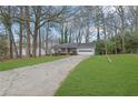 Front yard view of a single-story house with a long driveway at 4179 White Rd, Snellville, GA 30039