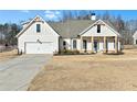 Two-story home with attached garage and manicured lawn at 43 Harmony Woods Dr, Dallas, GA 30157