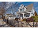 Two-story craftsman home with gray siding, brick accents, and a charming front porch at 1559 Walker Ave, College Park, GA 30337