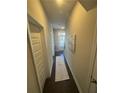 Bright hallway with neutral walls and dark hardwood floors at 1716 Prelude, Marietta, GA 30067