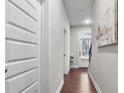 Inviting hallway with hardwood floors leads to the bright front door and stairs at 1716 Prelude, Marietta, GA 30067