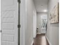 Inviting hallway with hardwood floors leads to the bright front door and stairs at 1716 Prelude, Marietta, GA 30067