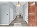 Bright entryway with light gray walls and wood-look flooring at 1855 Charleston Oak Cir, Lawrenceville, GA 30043