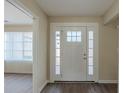 Bright entryway featuring a white front door with decorative glass and hardwood floors at 1890 Old Concord Se Dr, Covington, GA 30016