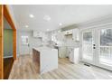 Light and airy kitchen with white cabinets, countertops, and a view of the backyard at 6467 Joanna St, Lithia Springs, GA 30122