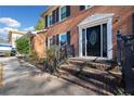 Front entrance with stairs and black door at 1956 Spencer Oaks Ln, Lithonia, GA 30058