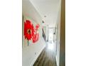 Bright and airy entryway with hardwood floors and modern staircase at 11118 Benton, Covington, GA 30014