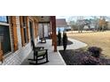 Front porch walkway leading to charming house exterior at 213 Cades Ct, Mcdonough, GA 30252