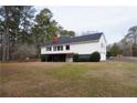 Ranch style home with attached garage and large backyard at 418 Hillview Rd, Hampton, GA 30228