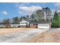 Ranch style home with brick and white siding, attached garage, and spacious yard at 1833 Queens Way, Chamblee, GA 30341