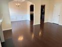 Bright dining room features hardwood floors and chandelier at 5138 Mcever View Dr, Sugar Hill, GA 30518