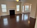 Spacious living room with hardwood floors and fireplace at 5138 Mcever View Dr, Sugar Hill, GA 30518