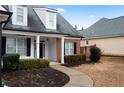 Home's entrance with a covered porch and landscaping at 23 Spring Folly Nw, Cartersville, GA 30121