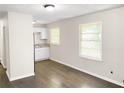 Bright dining area with kitchen and hardwood floors at 3777 Crosby Nw Dr, Atlanta, GA 30331