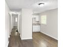 Hallway view of home's interior with hardwood floors at 3777 Crosby Nw Dr, Atlanta, GA 30331