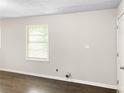 Simple living room with hardwood floors and neutral walls at 3777 Crosby Nw Dr, Atlanta, GA 30331