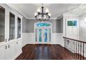 Elegant dining room with hardwood floors, built-in shelving, and chandelier at 3633 Habersham Rd, Atlanta, GA 30305