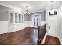 Elegant dining room with hardwood floors, built-in shelving, and chandelier at 3633 Habersham Rd, Atlanta, GA 30305