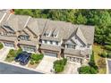 Townhouses with gray roofs and landscaping, aerial view at 5649 Cobblestone Creek Pl # 13, Mableton, GA 30126