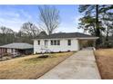 Well-maintained home with a covered carport and driveway situated on a generous lot at 2724 Larkspur Se Dr, Atlanta, GA 30316