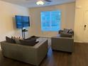 Spacious living room with dark hardwood floors and large windows at 2169 Olmadison Vw, Atlanta, GA 30349