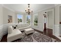 Bright sitting room with hardwood floors and large windows at 4562 Worthings Dr, Powder Springs, GA 30127