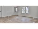 Bright living room featuring light wood flooring at 337 Theodore Cox Cir, Canton, GA 30114