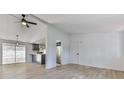 Open concept living and kitchen area with light flooring at 337 Theodore Cox Cir, Canton, GA 30114