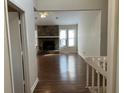 Living room with hardwood floors, fireplace, and vaulted ceiling at 3763 Woodrose Ct, Snellville, GA 30039