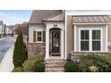 Inviting front entrance with brick accents and a charming wreath at 332 Symphony Se Way, Smyrna, GA 30080