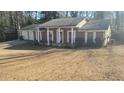 Brick ranch house with attached garage and front porch at 1850 Cashmere Ct, Lithonia, GA 30058